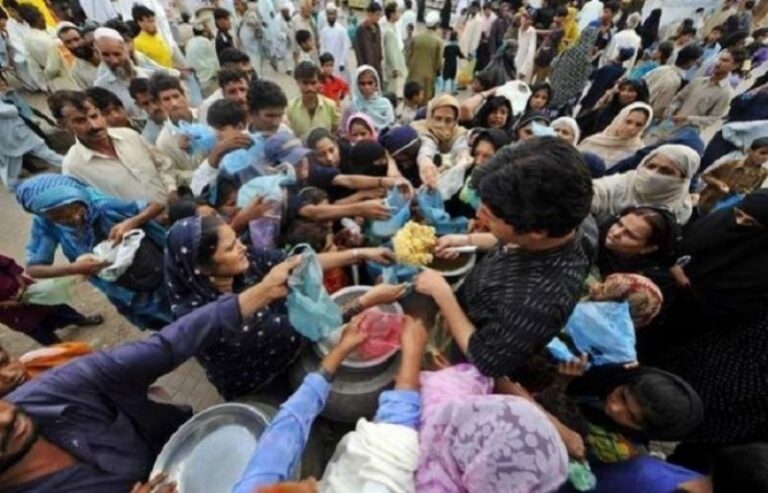 People trying to grab food in a busy market